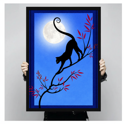 Framed moonlit branch black cat canvas held by a person against a light neutral background.