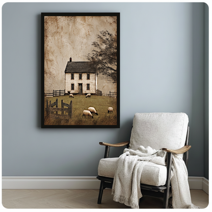 Framed old farmhouse grazing sheep canvas beside a pale reading chair on a blue gray wall.