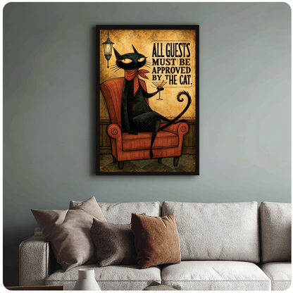 Framed cat approves all guests canvas above a neutral sofa with cushions against a muted wall.