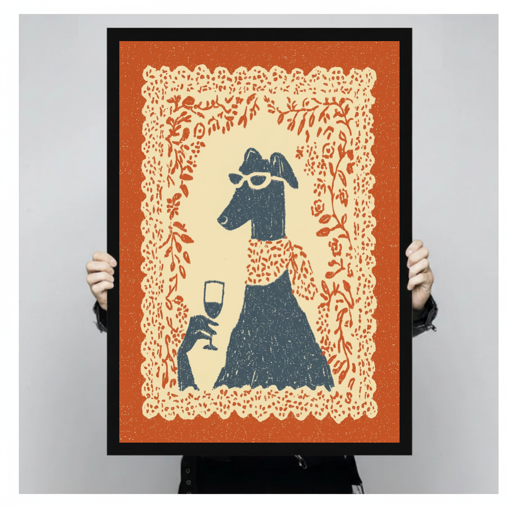 Framed sunglasses wine dog canvas held by a person against a light neutral background.