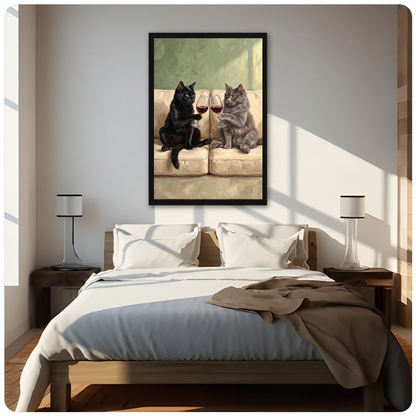 Framed cats clinking wine canvas above a neutral bed beside soft bedroom lighting and lamps.