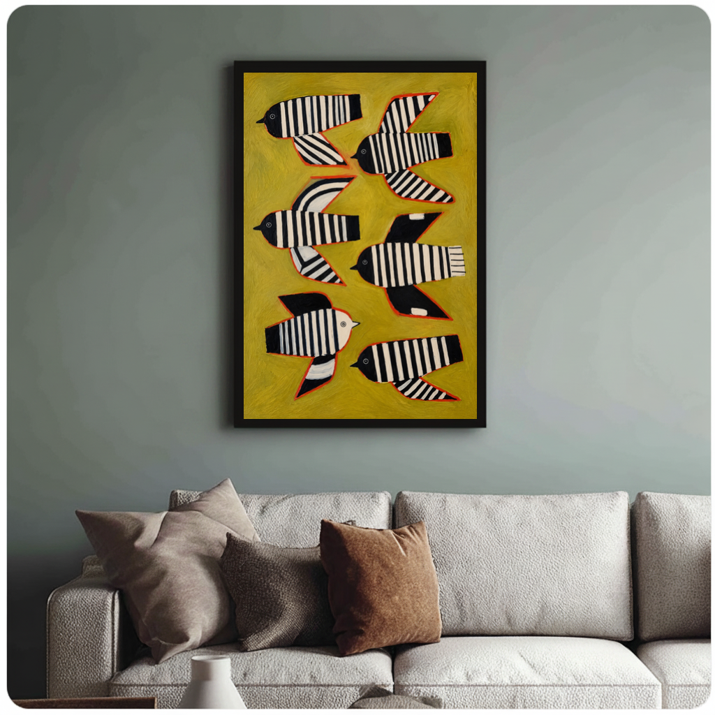 Framed six striped folk birds canvas above a neutral sofa with cushions against a muted wall.