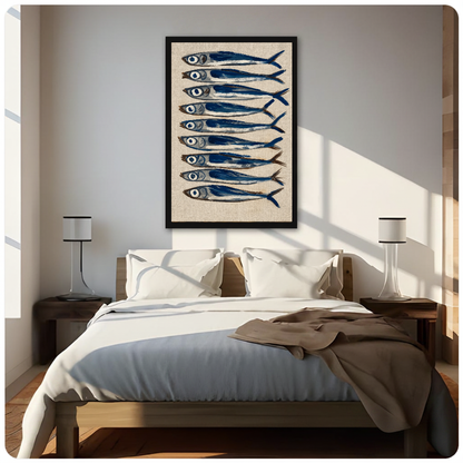 Framed nine blue sardines canvas above a neutral bed beside soft bedroom lighting and lamps.