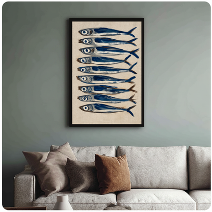 Framed nine blue sardines canvas above a neutral sofa with cushions against a muted wall.