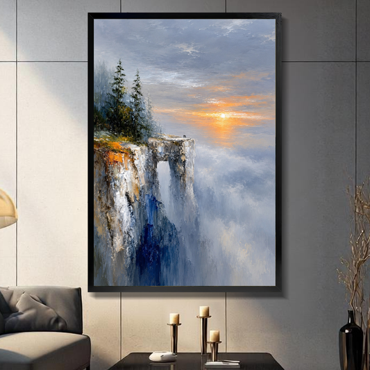 Black framed golden cliff sunrise canvas on a dark paneled wall beside warm candles.