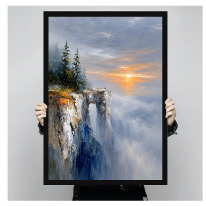 Framed golden cliff sunrise canvas held by a person against a light neutral background.