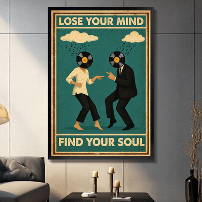 Black framed vinyl head dancing couple canvas on a dark paneled wall beside warm candles.