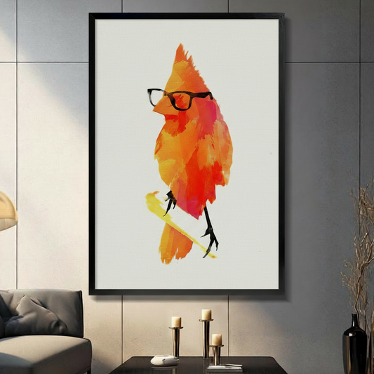 Gallery wrapped canvas wall art of a vibrant orange-red watercolor cardinal bird wearing black glasses, displayed on a grey tile wall in a modern living room