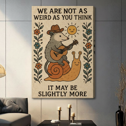 Gallery wrap stretched canvas of a whimsical cowboy opossum riding a snail with We Are Not As Weird As You Think quote hung frameless on a dark gray wall above candlestick holders