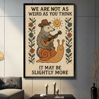 Black framed funny opossum playing guitar on a snail canvas wall art with linen background and floral border displayed in a modern dark gray living room with candlesticks and black vase