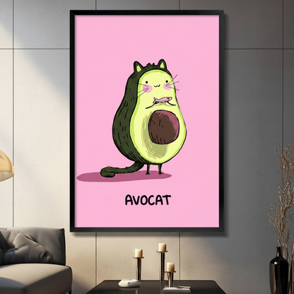 Black framed whimsical Avocat avocado cat canvas art with a chubby round dark green avocado body shaped cartoon cat with small cat ears pink cheeks long white whiskers a tiny fish in its mouth a curling green tail and a visible brown pit belly standing on bird-like feet above bold black Avocat lettering on a bright bubblegum pink background, hung on a gray panel wall above a dark gray sofa
