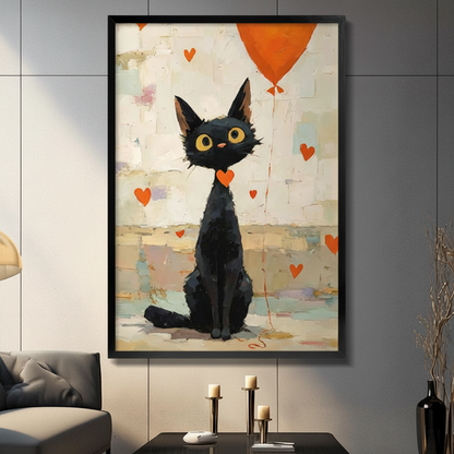 Whimsical black cat with orange balloon and floating red hearts framed wall art print in a black frame, hung on a dark grey wall above a console table with candle holders and a table lamp in a modern living room