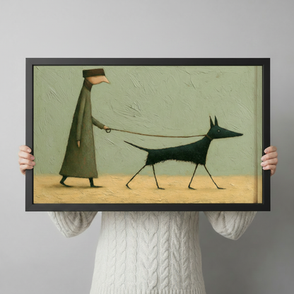 Hand-held close-up of a black-framed surrealist art print showing a tall whimsical figure in a coat walking an elegant black dog on a leash against a sage green background