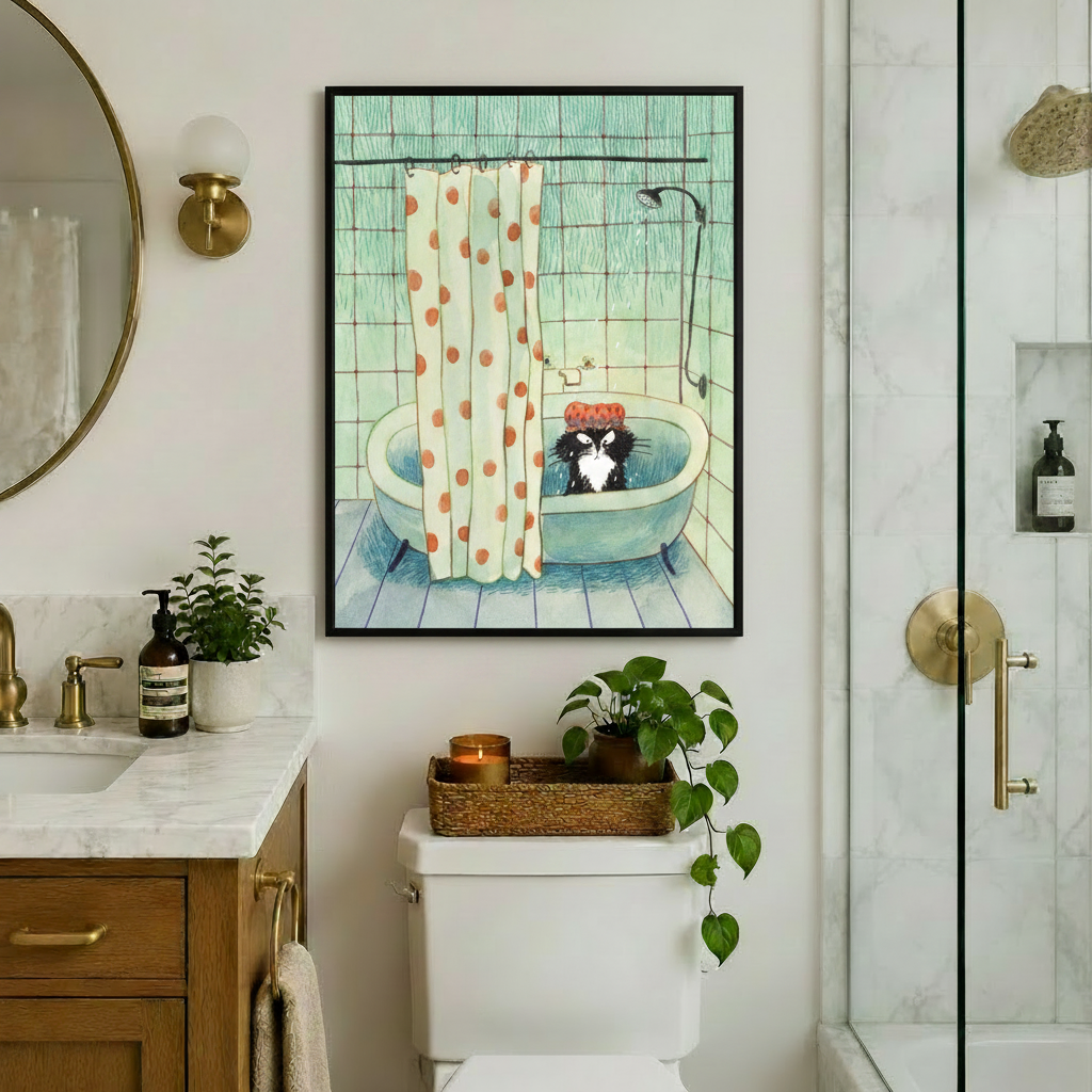 Black framed vintage-style grumpy cat in bathtub canvas art featuring a disgruntled tuxedo cat in a red polka dot shower cap in a teal tub with an orange dotted shower curtain on a mint tiled wall, displayed in an elegant bathroom above a toilet with brass fixtures, round mirror, wooden marble vanity, trailing pothos plant, and glass shower enclosure