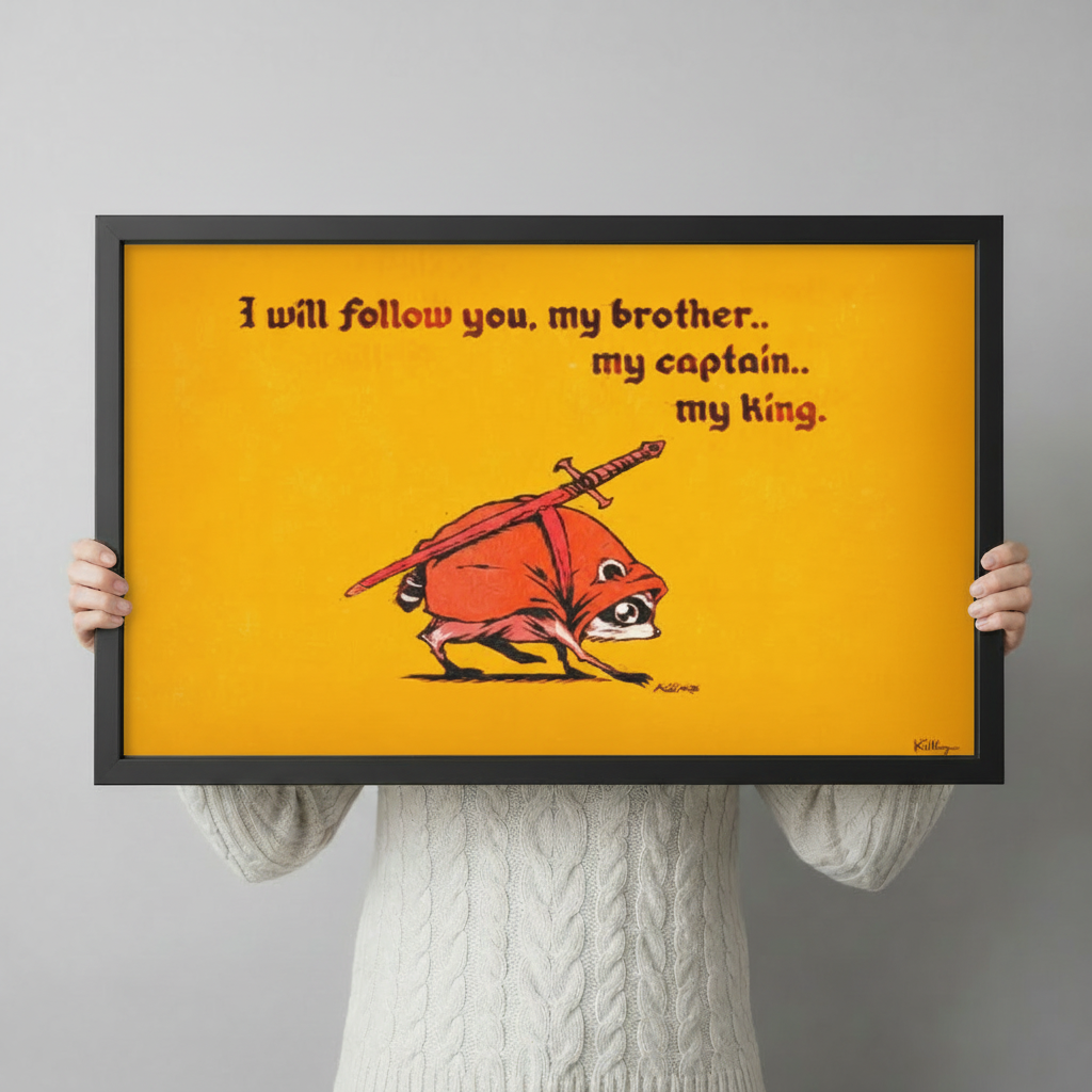 Person in a cream knit sweater holding a large horizontal black framed whimsical raccoon knight My King canvas art print with a small hunched raccoon in a red cloak charging with a long sword on its back on a vivid golden yellow background with dark red medieval hand-lettered I Will Follow You My Brother My Captain My King quote signed Killroy