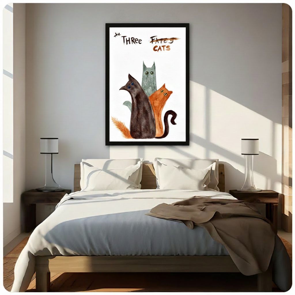 Black framed whimsical The Three Cats watercolor canvas art with a dark brown cat a teal-gray cat and a rust orange cat grouped with wide quirky eyes and bold hand-lettered The Three Fates crossed out Cats title in loose expressive watercolor style on a white background, hung above a dark wood bed with white linen bedding in a sunlit bedroom