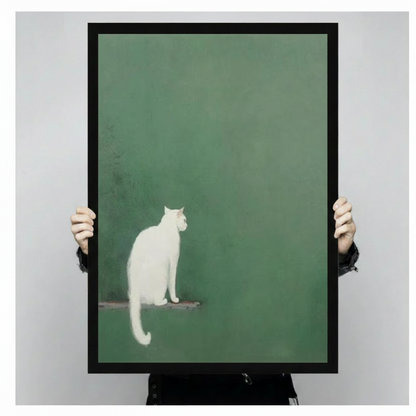 Hands holding large framed white cat on perch canvas print - full artwork detail of minimalist cat glancing back on deep sage green textured background