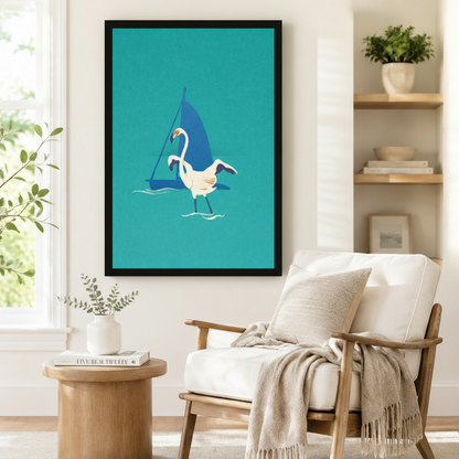 Framed minimalist flamingo and sailboat teal art print with bold color block design displayed beside a white linen armchair in a bright Scandinavian reading corner