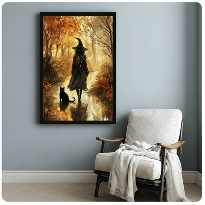 Oil painting of a witch in a black coat and pointed hat walking along a glowing autumn forest stream beside a black cat with golden foliage and warm misty light witch wall art framed print beside linen armchair on blue-gray wall