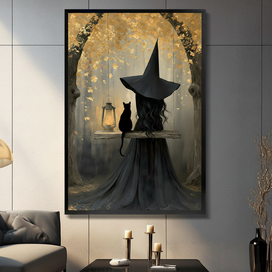 Gothic oil painting of a witch in a tall black hat and long dark cloak sitting on a wooden swing beside a black cat with a glowing vintage lantern under a golden autumn leaf tree arch dark romantic witch and cat wall art framed print in a living room with dark gray sofa candle holders and black vase