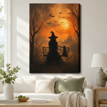 Stretched canvas halloween art print of a witch and black cat silhouette on a garden bench surrounded by bare trees and bats under an amber moonlit sky, hung above a white sofa in a living room