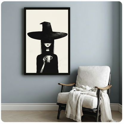 Framed gothic witch with coffee cup minimalist wall art print on blue-grey wall beside white linen armchair
