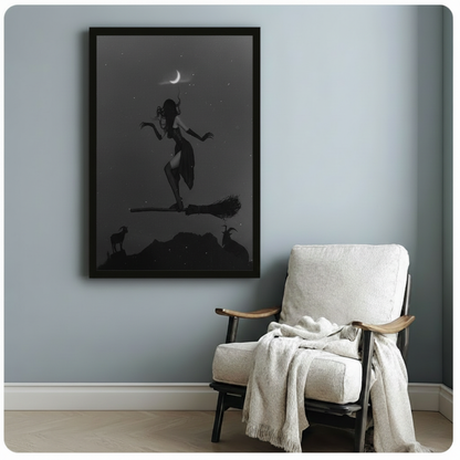 Framed witch flying on broomstick wall art print on pale blue-grey wall beside linen armchair, dark mystical bedroom or living room decor