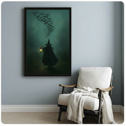 Black framed witch and bat flock art print on light gray wall beside a linen armchair, gothic Halloween home decor wall art