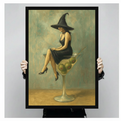 Unframed art print of a mysterious witch in a black dress and tall pointed hat sitting atop a giant martini glass with olives, gothic Halloween wall decor