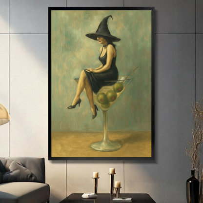 Framed canvas wall art of a elegant witch in a black dress and wide-brim hat sitting on a giant martini glass with olives, vintage oil painting style, displayed in a modern living room