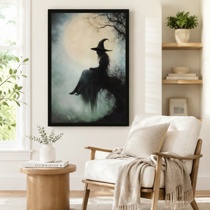 Black framed witchcore gothic witch silhouette full moon foggy forest dark academia oil painting print beside armchair in minimalist reading corner