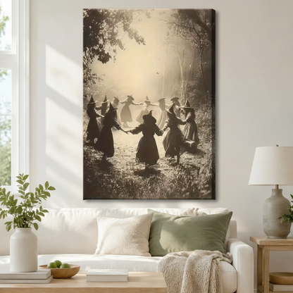 Gallery-wrapped canvas of witches holding hands in a misty forest circle hung above a white sofa – vintage Halloween sepia wall art print