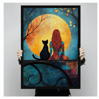 Colorful painting of a red-haired woman sitting beside a black cat on an ornate iron balcony railing in front of a large golden full moon and teal autumn night sky cat and woman wall art framed print held against light gray background