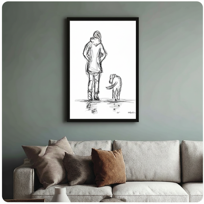 Framed black and white woman and dog pencil sketch print mounted above a textured linen sofa against a sage green wall
