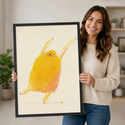 Woman holding large framed whimsical yellow bird watercolor canvas print showing artwork size reference