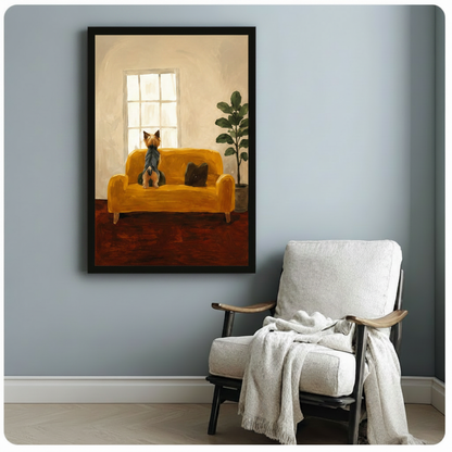 Black framed Yorkie dog art print of terrier seated on yellow velvet couch facing window light, styled beside white linen armchair