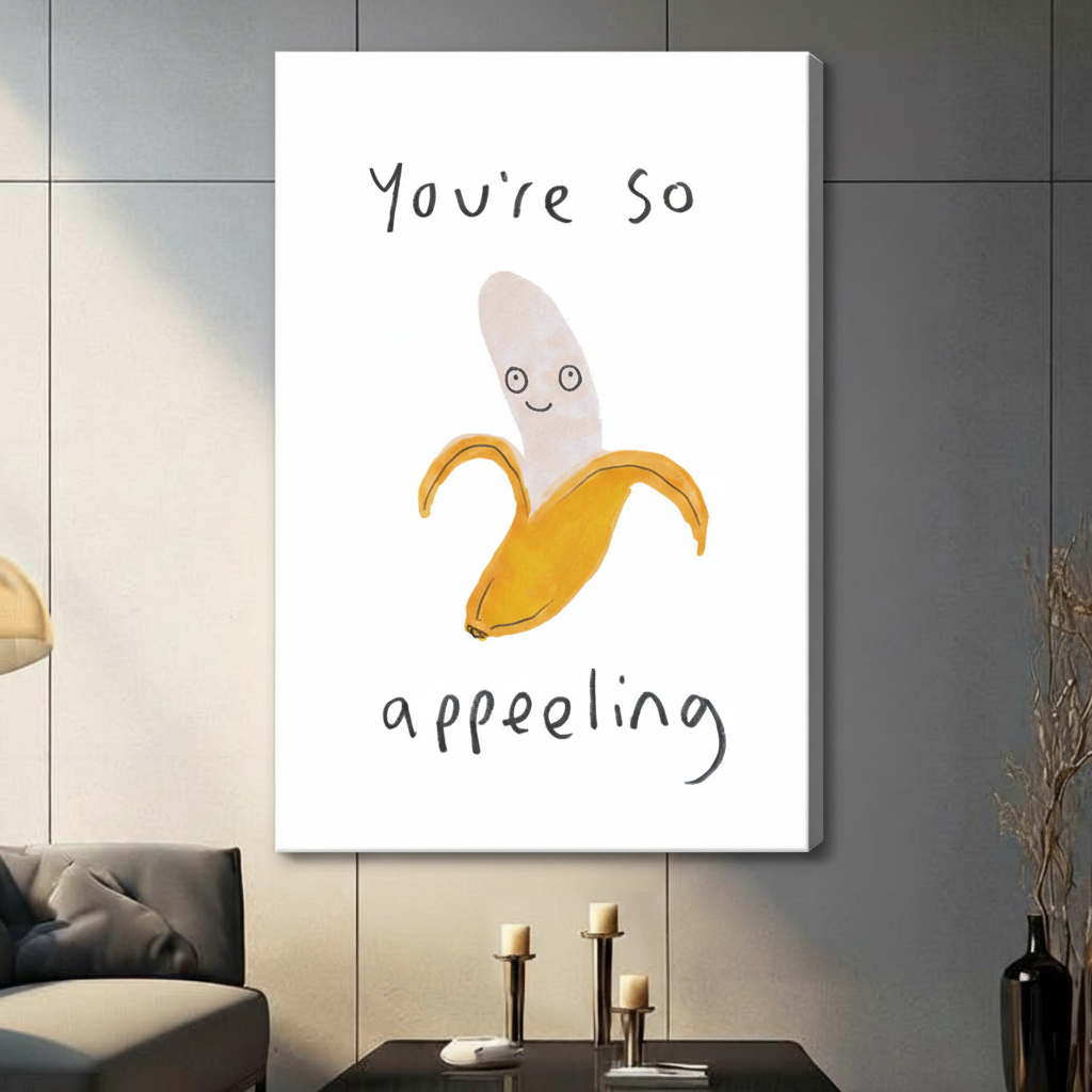 Unframed canvas wall art of smiling peeled banana with "You're So Appealing" pun text, large format display on grey wall with candles